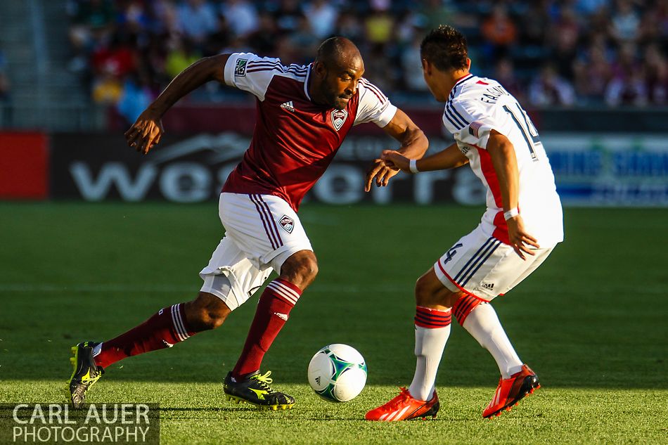 July 17th, 2013 - Colorado Rapids defender Marvell Wynne (22) attempts to drive the ball past New England Revolution forward Diego Fagundez (14) in first half action of the Major League Soccer match between the New England Revolution and the Colorado Rapids at Dick's Sporting Goods Park in Commerce City, CO