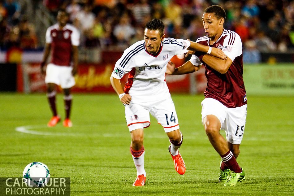 July 17th, 2013 - New England Revolution forward Diego Fagundez (14) and Colorado Rapids defender Chris Klute (15) battle for control of the ball in the second half of action in the Major League Soccer match between the New England Revolution and the Colorado Rapids at Dick's Sporting Goods Park in Commerce City, CO