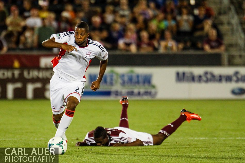 July 17th, 2013 - Leaving Colorado Rapids midfielder Atiba Harris (16) face down on the field, New England Revolution defender Andrew Farrell (2) storms down the pitch with the ball in the second half of the Major League Soccer match between the New England Revolution and the Colorado Rapids at Dick's Sporting Goods Park in Commerce City, CO