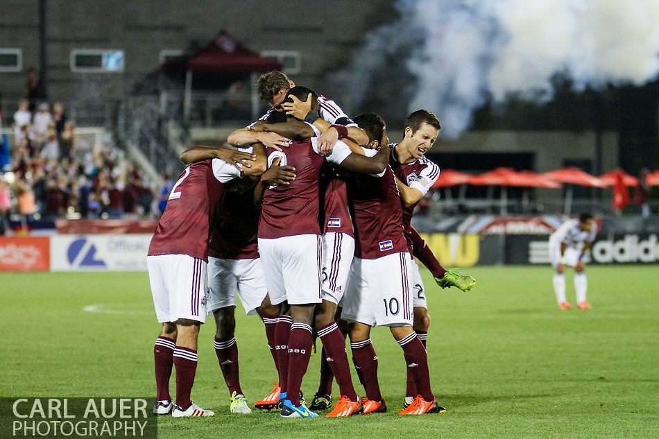 August 17th, 2013 - The Colorado Rapids surround forward Edson Buddle (9) after his goal in the second half of the Major League Soccer match between the Vancouver Whitecaps FC and the Colorado Rapids at Dick's Sporting Goods Park in Commerce City, CO