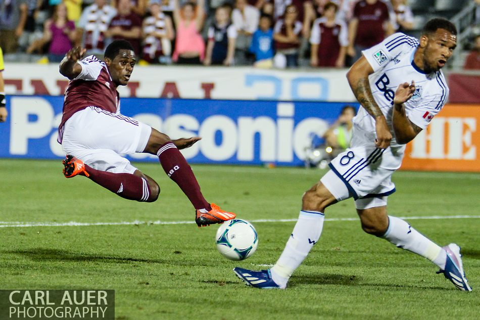 August 17th, 2013 - Colorado Rapids forward Deshorn Brown (26) attempts an acrobatic shot that is blocked by Vancouver Whitecaps FC midfielder Matt Watson (8) in second half action of the Major League Soccer match between the Vancouver Whitecaps FC and the Colorado Rapids at Dick's Sporting Goods Park in Commerce City, CO