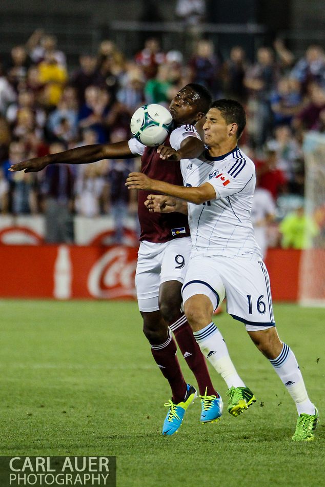 August 17th, 2013 - Colorado Rapids forward Edson Buddle (9) and Vancouver Whitecaps FC defender Johnny Leveron (16) battle for control of the ball in the second half of the Major League Soccer match between the Vancouver Whitecaps FC and the Colorado Rapids at Dick's Sporting Goods Park in Commerce City, CO