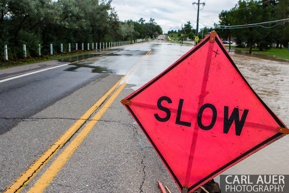 September 13, 2013: Alkire Street in Arvada, CO disappears under water as a small creek overflows its banks after record breaking rains hit Colorado over the last few days (Carl Auer)