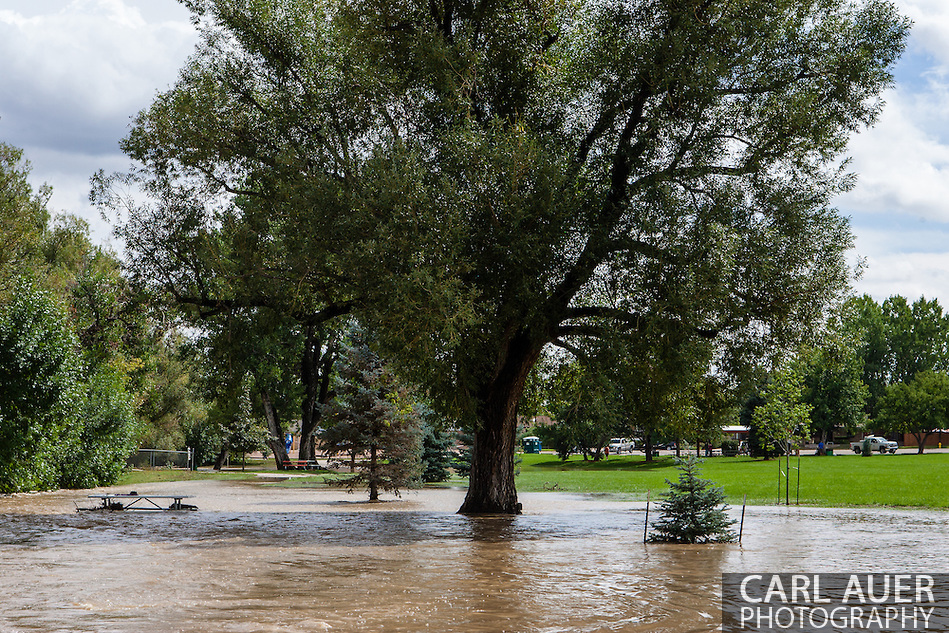 September 13, 2013: Ralston Creek overflows its banks and floods the Ralston Creek Trail bike path and picnic areas off of Oak Street in Arvada after record breaking rains hit Colorado over the last few days (Carl Auer)